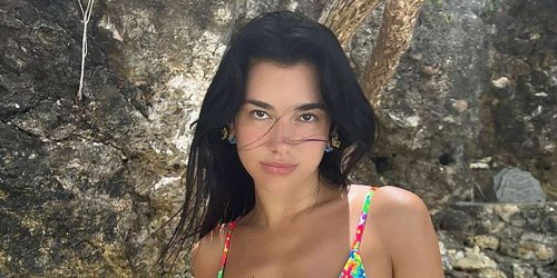 Dua Lipa's Vacation Wardrobe Included a See-Through Crochet Dress and a Belted Bra
