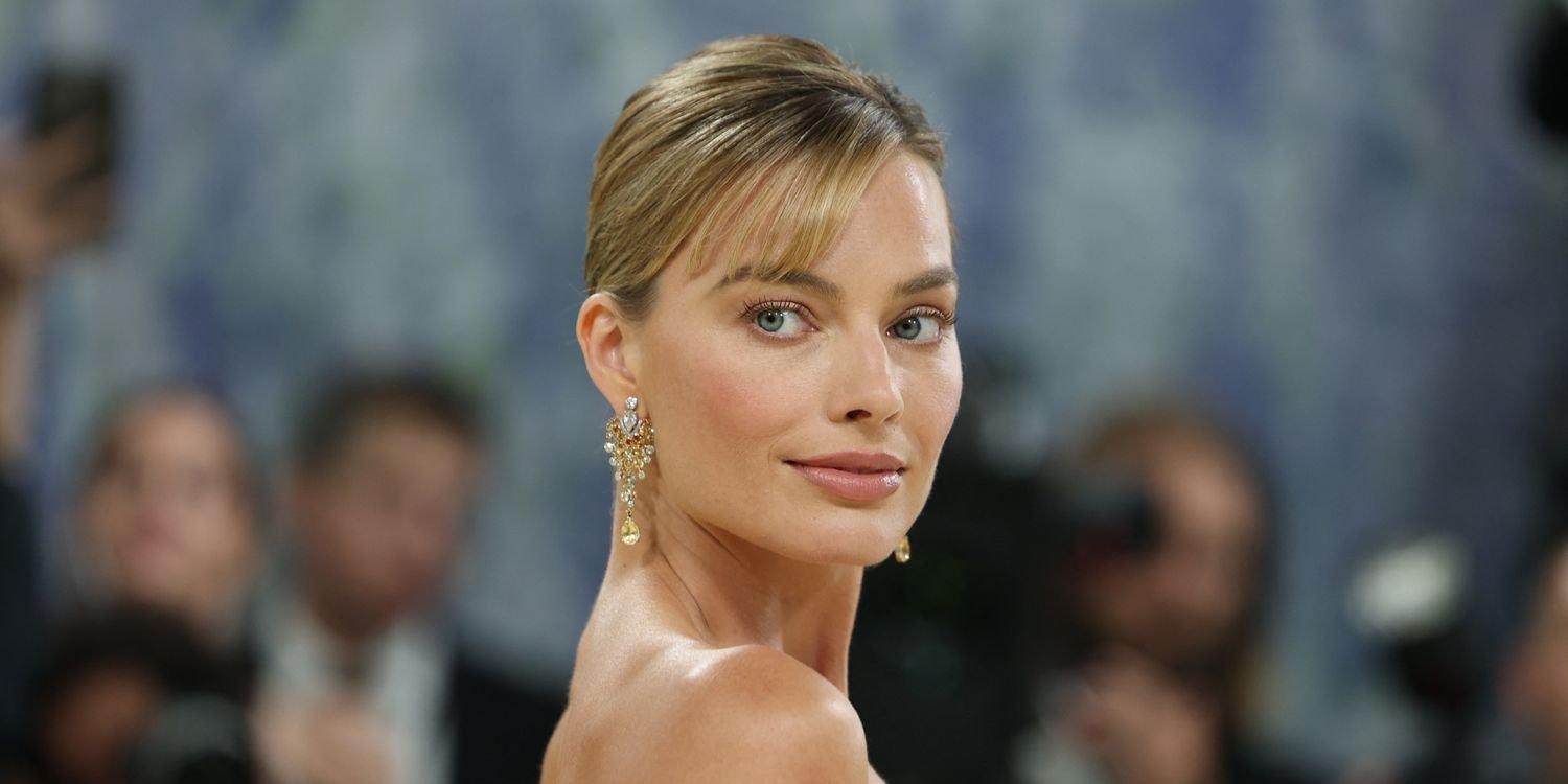 Margot Robbie Radiates in Her Lightest Hair Color in Years and Lacy Butter Yellow Skirt Set in Paris