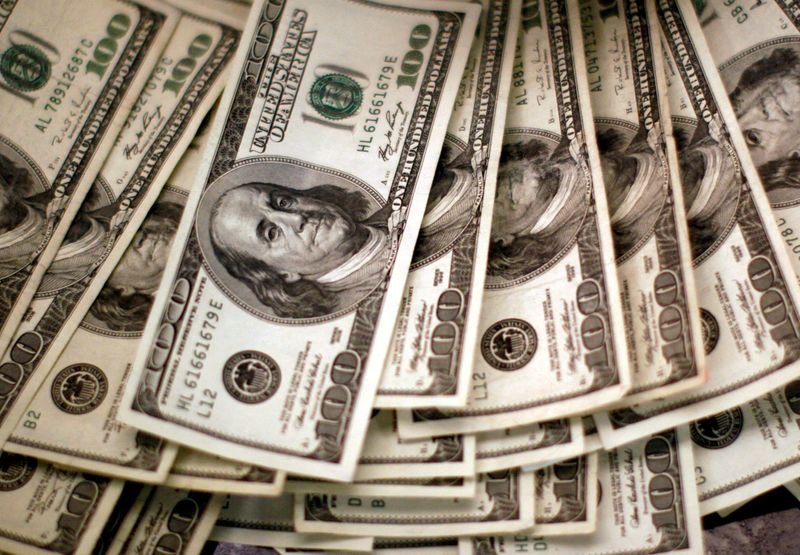 Dollar steady as investors eye release of US data backlog
