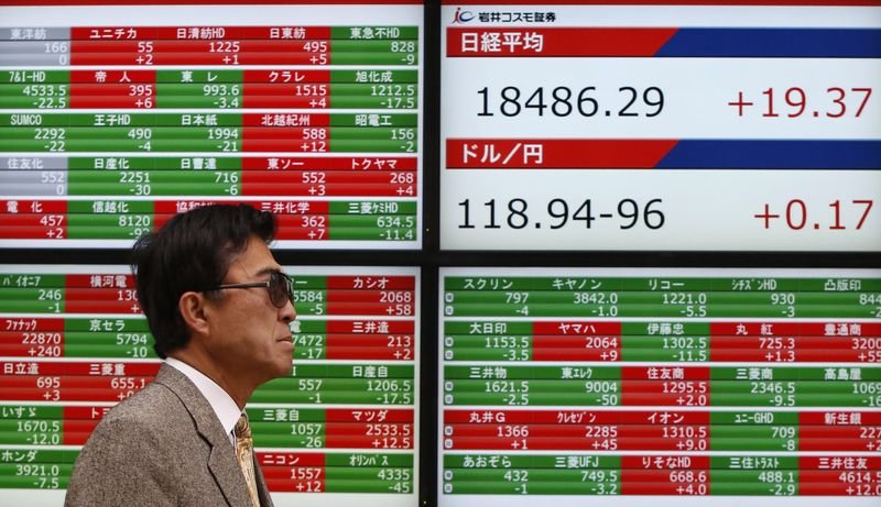 Japan stocks soar to record highs, yen slumps after Takaichi wins LDP election