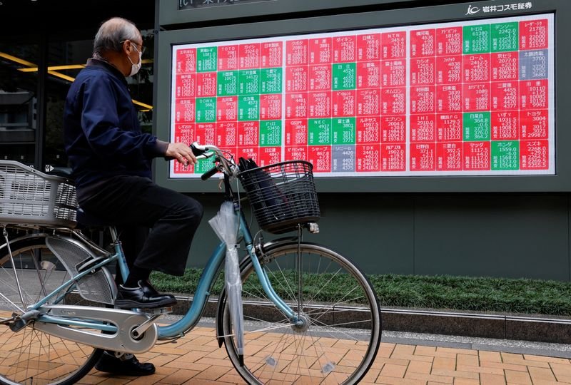 Asian stocks hit record high, dollar wobbles on peace deal hopes