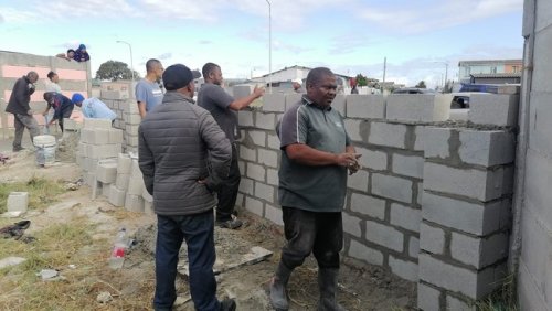 City of Cape Town threatens to demolish a crime prevention wall built by residents