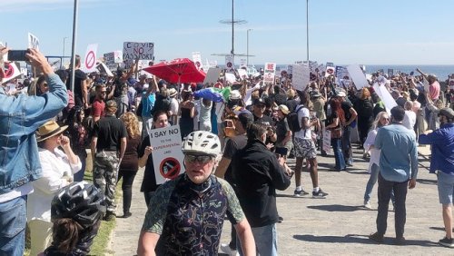 Anti-vaxxers face criminal action after maskless protest