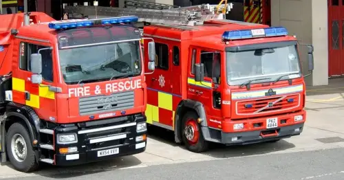 Belfast apartment block evacuated after masked men started 'number of fires'