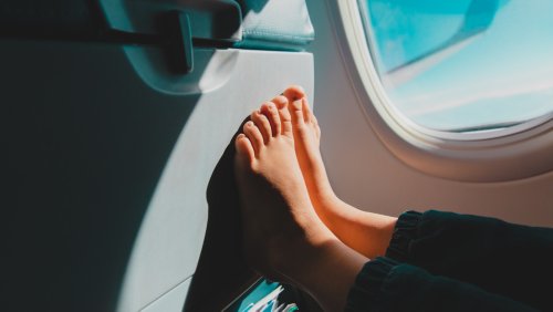 Why You Should Think Twice Before Taking Your Shoes Off On A Flight