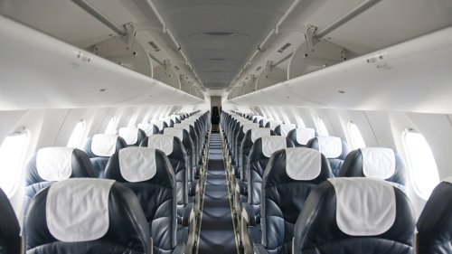 Here's What Those Triangle Stickers Above Airplane Windows Are Really For