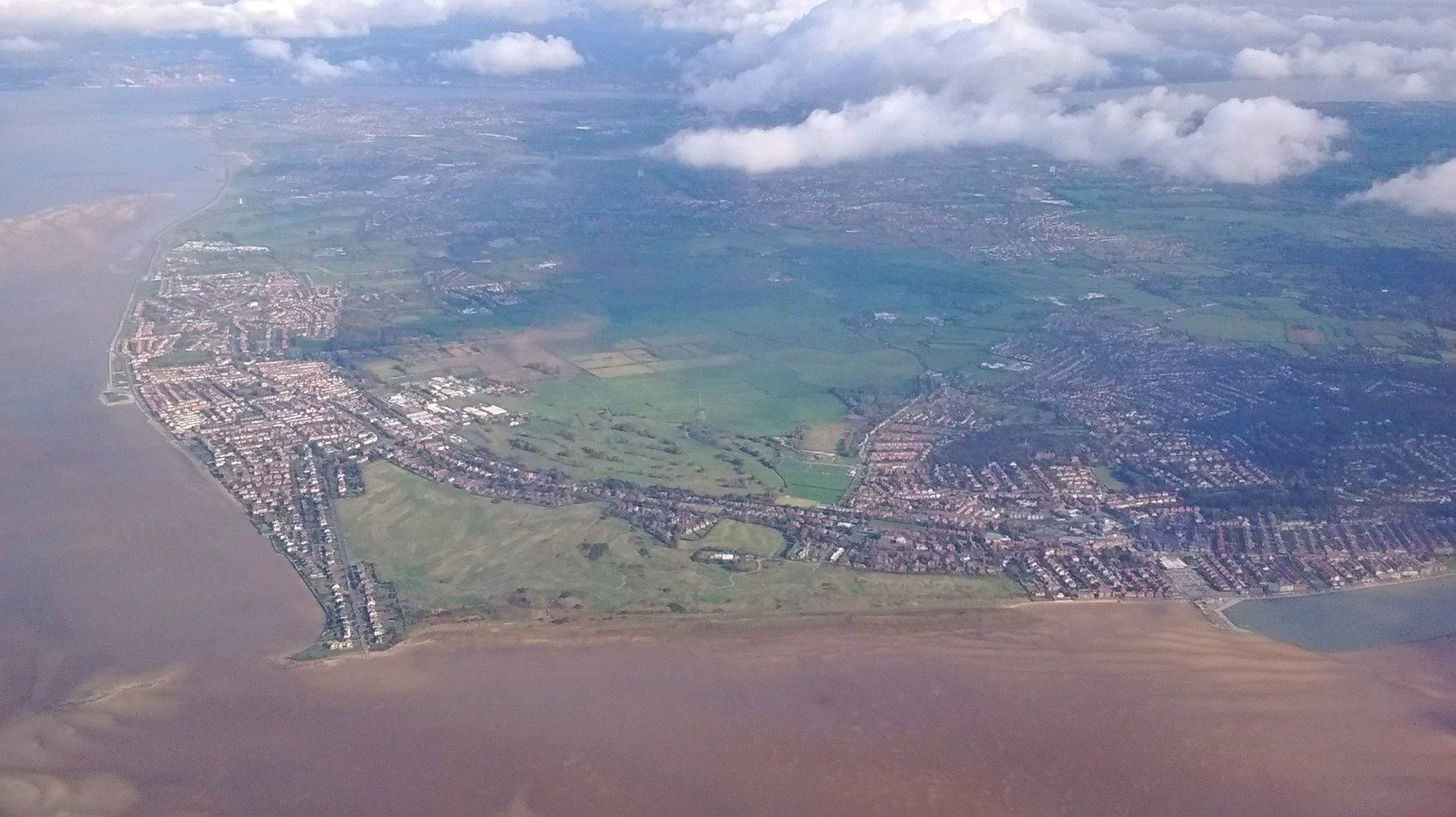 Tucked Near Liverpool Is England's Historic Seaside Town With Shops, A Lovely Beach, And An Iconic Golf Course