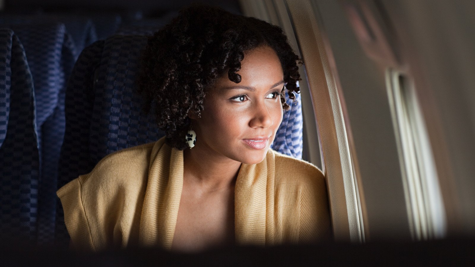 What To Do When Your Airplane Seatmate Invades Your Personal Space