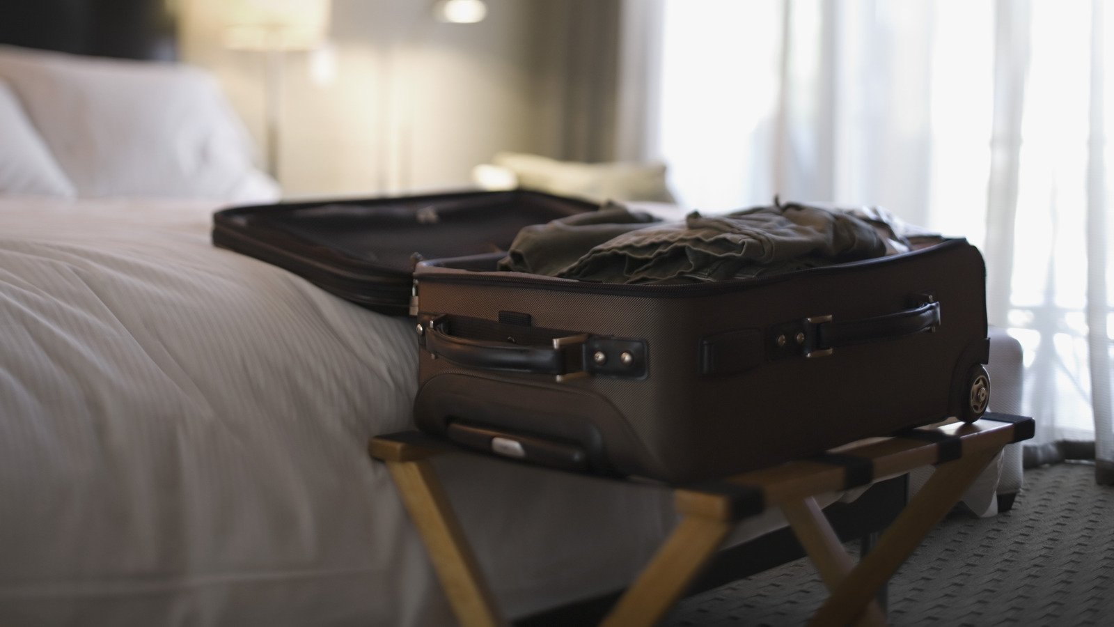 The Gross Reason You Should Avoid Using The Luggage Rack In Your Hotel Room