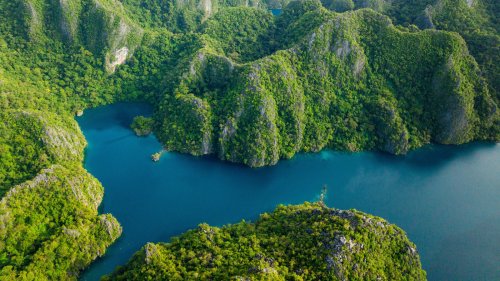 One Of The World's Clearest Lakes Is A Mesmerizing Spot In The Philippines With Epic Rock Formations