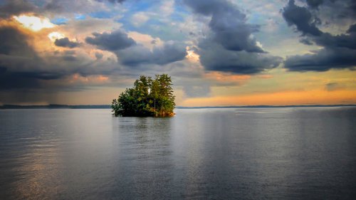 New England's Deepest Lake Is A 'Vast Summer Playground' In Maine With Beaches, Camping, And Recreation