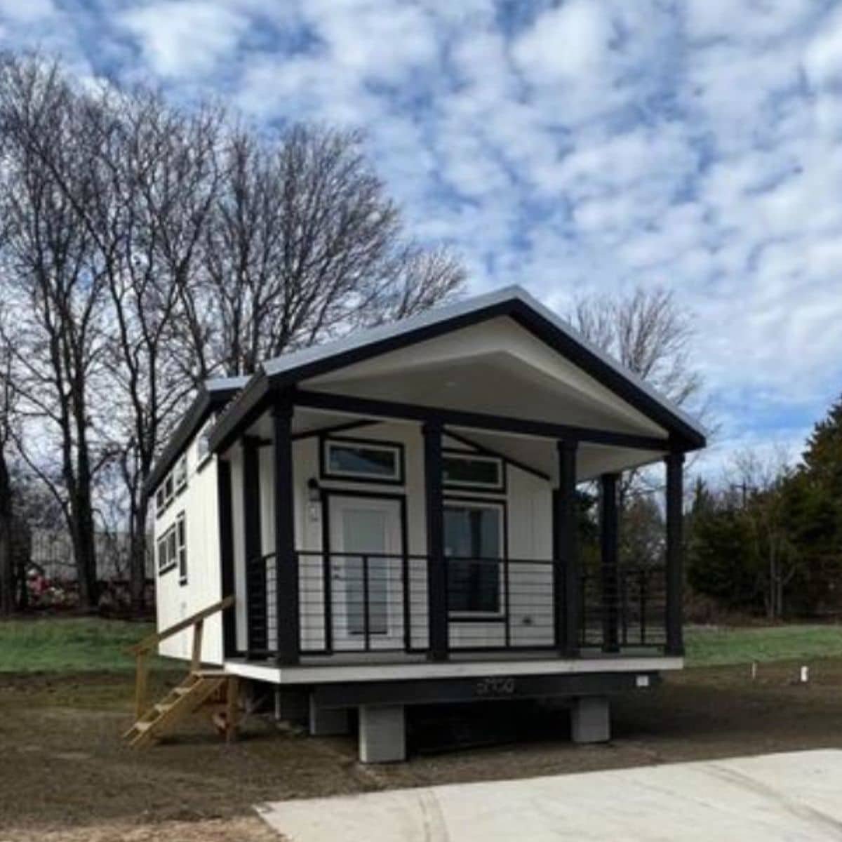 RVIA Certified 26′ Tiny Home with Porch is a Welcoming Space