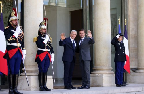 Revive Israeli-Palestinian peace process, Macron tells Lapid