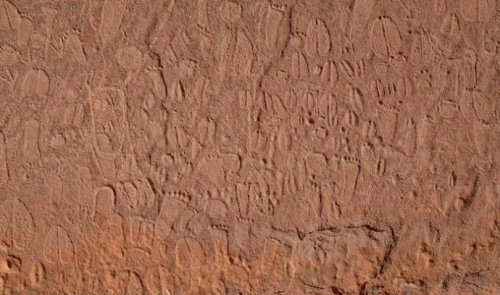 Stone age artists carved detailed human and animal rock art in Namibia