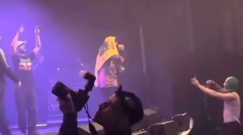 Kneecap band member charged with terrorism for displaying Hezbollah flag at concert