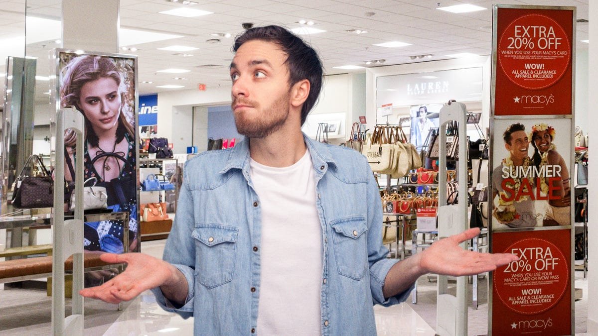 Man Exiting Store While Alarm Sounds Makes Big Show Of Looking Surprised To Appear Innocent