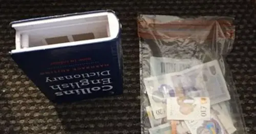 English dictionary packed with cash seized as police launch raids across Fylde Coast
