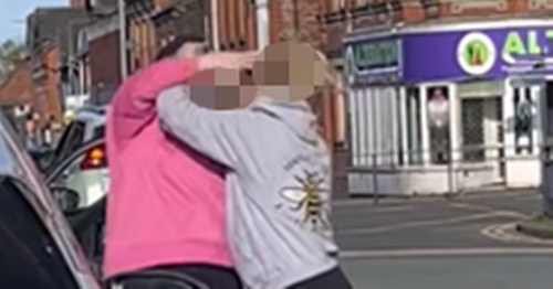 Mayhem as fight spills out between two women as they sit at traffic lights
