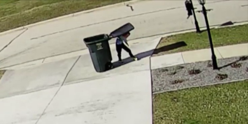 A Kid Tries to Take the Garbage Out on a Windy Day