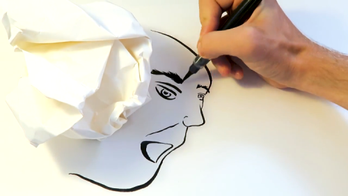London Artist Draws Strange Faces Using the Shadow of a Crumpled Up Piece of Paper
