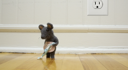 An Adorable Stop Motion Animation of a Tiny Felt Mouse Cleaning the Floor With a Tiny Felt Vacuum