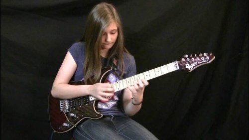 Teenage Girl Plays Van Halen’s ‘Eruption’ Guitar Solo With Laser Precision and An Amused Look on Her Face