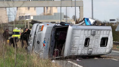 Seventeen rushed to hospital after bus carrying football fans overturns on motorway in multiple car smash