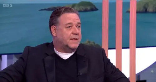 Russell Crowe's appearance distracts fans as he explains why he's a Leeds United diehard and part owner