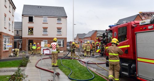 Two taken to hospital after fire rips through houses