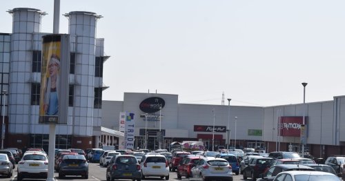 Woman, 20, kicked and punched by mob outside retail park