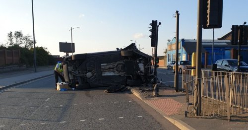 Suspected drunk driver flips Bentley Bentayga crashing into traffic lights