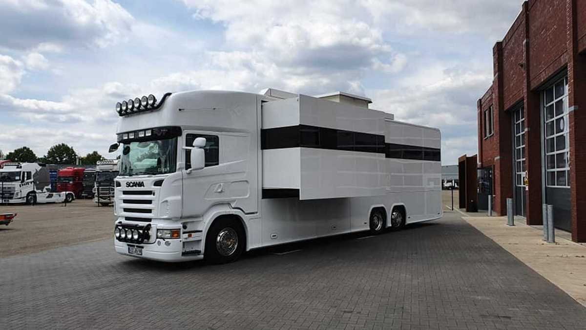 A commodious living room, three posh bedrooms, and a well-equipped garage, this fancy Scania RV has it all