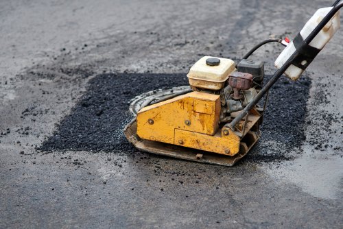 Can Insurance Help Cover Asphalt Paving Repair for Your Business’ Driveway?