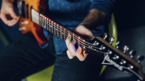 Learn guitar with these LED fret trainers and donate to charity at the same time