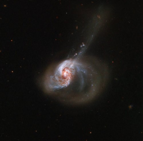 Two galaxies collide in this majestic Hubble image