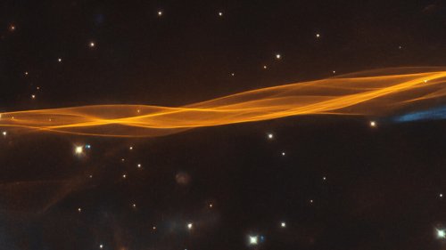 Hubble captures the remains of a dead star, a gorgeous orange space ribbon