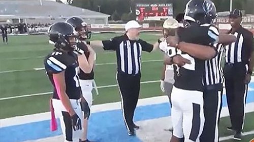 Military dad deployed for a year surprises son at his football game by dressing as a referee