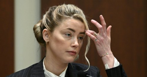 Amber Heard escorted out of court by police to avoid Johnny Depp supporters