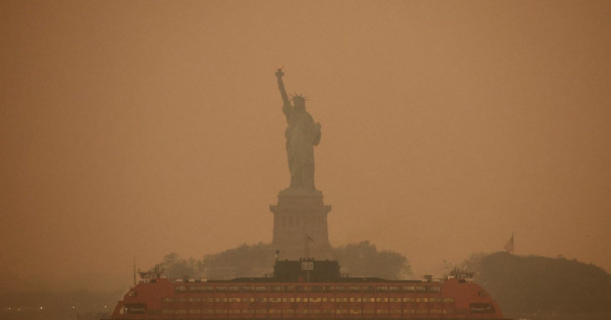Astonishing photos show New York blanketed in orange haze caused by wildfires