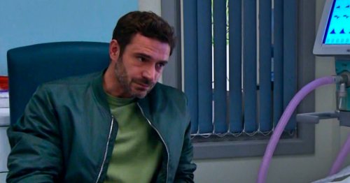 Who is John visiting in the hospital bed in Emmerdale?