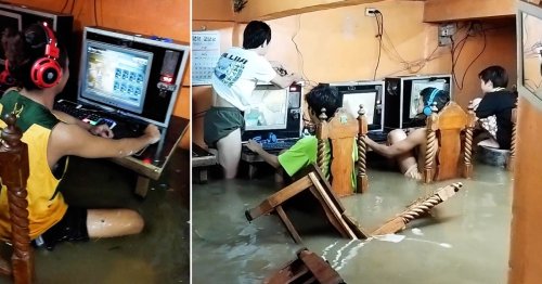 Hardcore gamers carry on playing as room floods during typhoon
