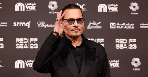 Johnny Depp resumes Hollywood life rubbing shoulders with Sharon Stone and Will Smith at A-list bash