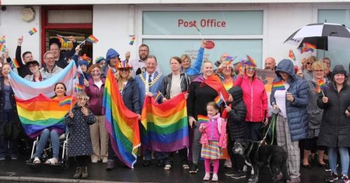 Villagers support gay couple sent homophobic letters for Pride flag outside shop