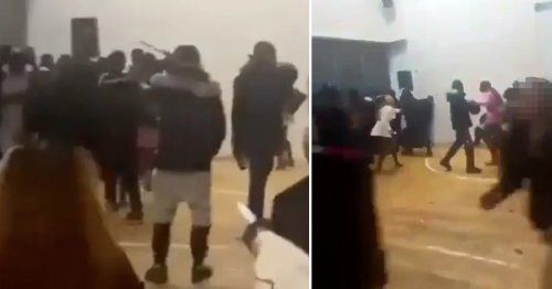 Two children stabbed after party in school hall is stormed by armed gang
