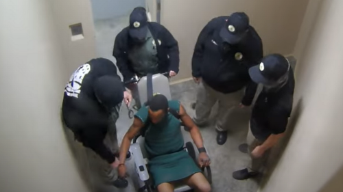Officer uses chain to strangle man in solitary confinement as guards watch, lawsuit says