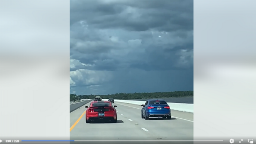 Drivers racing on Florida bridge get unpleasant surprise as 3rd vehicle joins, cops say