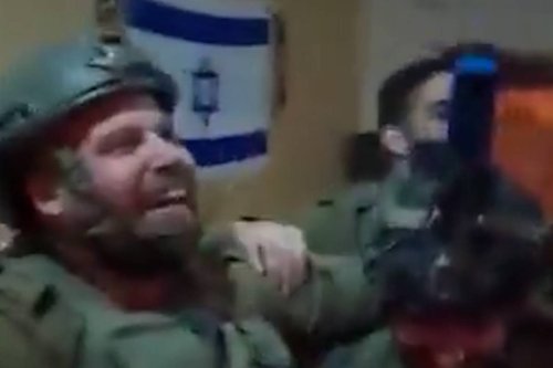 Israeli soldiers celebrate the announcement of a wedding date while bombing houses in Gaza
