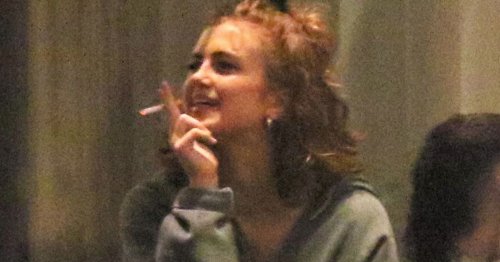 Maisie Smith has a late night cigarette break during Strictly tour rehearsals