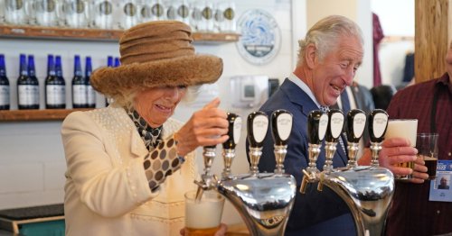 Charles and Camilla knock back pints in Canadian pub and joke about cooking moose