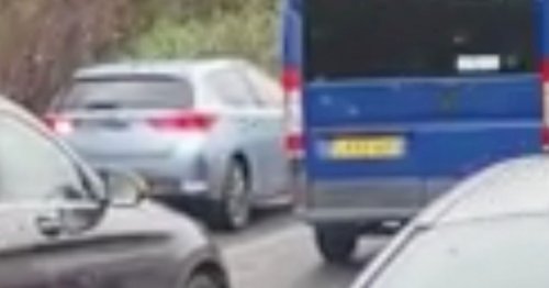 Shocking moment driver reverses down the motorway to get out of gridlock traffic